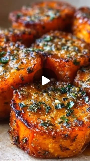 Saif Antiinflammatory Kitchen on Instagram: "Garlic Herb Roasted Sweet Potato Rounds
Prep Time: 10 minutes
Cook Time: 30 minutes
Total Time: 40 minutes
Servings: 4
Ingredients
For the Sweet Potatoes:
2 large sweet potatoes, peeled and cut into 1-inch thick rounds
2 tbsp olive oil
2 tbsp melted butter
4 garlic cloves, minced
1 tsp smoked paprika
1 tsp Italian seasoning
½ tsp onion powder
½ tsp salt
½ tsp black pepper
¼ tsp cayenne pepper (optional)
For Garnish:
2 tbsp fresh parsley, finely chopped
2 tbsp grated Parmesan cheese
Extra melted butter for brushing (optional)
Instructions
Preheat the oven to 400°F (200°C) and line a baking tray with parchment paper.
In a bowl, whisk together the olive oil, melted butter, garlic, smoked paprika, Italian seasoning, onion powder, salt, black pepper, and cayenne pepper.
Arrange the sweet potato rounds in a single layer on the prepared baking tray.
Brush both sides generously with the garlic herb mixture.
Roast for 15 minutes, then flip the rounds and brush with any remaining seasoning mixture.
Continue roasting for another 12–15 minutes, until the sweet potatoes are tender inside and caramelized around the edges.
Remove from the oven and immediately sprinkle with Parmesan cheese and chopped parsley.
Serve warm as a side dish, appetizer, or healthy snack.
Notes
For extra crisp edges, broil for 2–3 minutes before serving.
Fresh thyme or rosemary can be added for deeper herb flavor.
Store leftovers in an airtight container in the refrigerator for up to 3 days.
Reheat in the oven or air fryer to restore crispness."